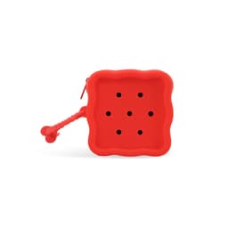 A red square silicone pouch with six holes and a textured handle, featuring a logo on the side.