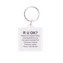 A square acrylic keyring with a clear design and a metal ring, featuring printed text and a logo.