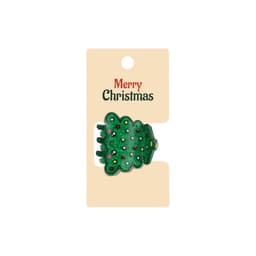 A green Christmas tree hair claw with colourful decorations, presented on a cardboard backing with a logo.