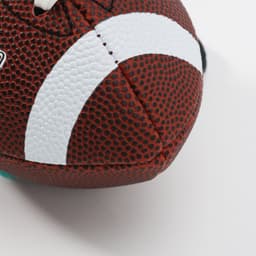 A mini promotional American football in red and black with white detailing and a logo.