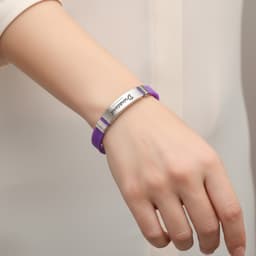 A purple metal folding lock clasp bangle worn on a wrist, featuring a silver band with branding.