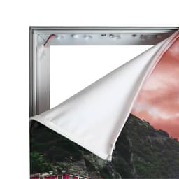 A backlit LED light box display with a grey frame and a partially removed fabric graphic.