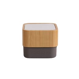 A bamboo Bluetooth wireless speaker featuring a textured wooden exterior and a dark control base.