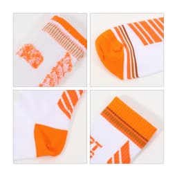 Crew woven sport socks in white and orange, featuring various patterns and stripes, with a logo present on the design.