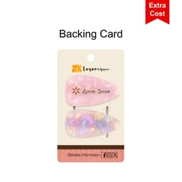 A backing card featuring two hair clips: one pink and one iridescent with a shiny finish, along with a logo.