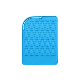 A blue silicone hair straightener pad with a textured wave pattern and a hanging loop. It features a logo.