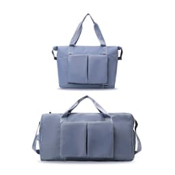 A foldable sports duffle bag in light blue with two front pockets and dual handles for carrying.