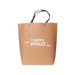 A large brown boutique paper bag with black handles and a logo on the front.