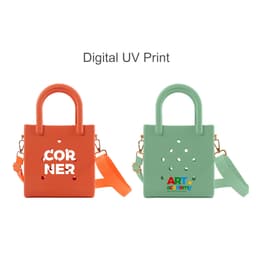 A mini beach bag in orange and green featuring cut-out holes and carrying handles. Each bag has a logo.