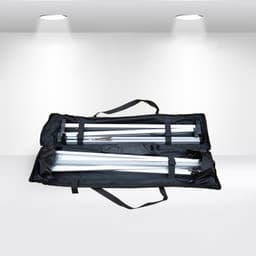 A black carrying case containing disassembled metal poles for an A-frame banner stand.