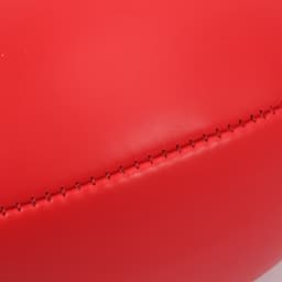 A red mini promotional Aussie Rules ball with visible stitching detail. It features a branding logo.