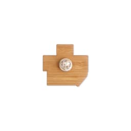 A custom-shaped bamboo lapel pin in a light brown colour, featuring a logo on the back.