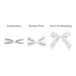 Three adhesive bows in white, featuring different designs: a checked pattern, text in black, and hot foil stamping details.