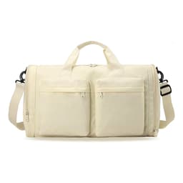 A foldable travel duffle bag in cream with two front pockets and a detachable shoulder strap. Features a logo.