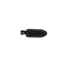 A denim hair clip in black with yellow stitching, featuring a plastic clasp and a simple design.