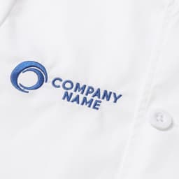 A white chef jacket with short sleeves and a double-breasted design featuring a logo and embroidered text.