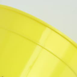 A yellow plastic stadium cup with a smooth surface and a simple design, featuring a logo.