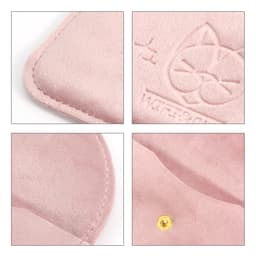 A pink velvet jewelry pouch with a cat design and a gold snap closure. Features smooth stitching and soft texture.