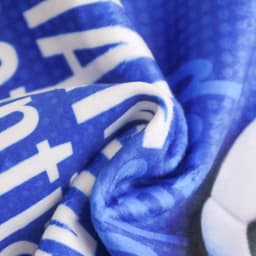 A blue sports towel made of soft material with a smooth texture, featuring a logo.