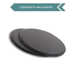Two black yoga sliding disks are shown side by side, designed for easy portability. Each disk features a smooth surface.