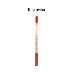 A bamboo toothbrush with a large round handle featuring red accents and a logo.