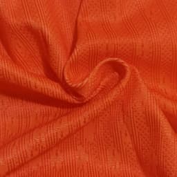 Bright orange fabric with a textured pattern, suitable for breathable sports shorts. Includes a logo or branding.