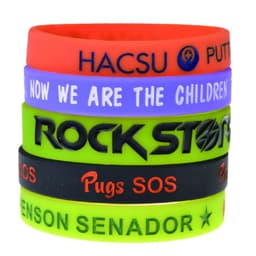 A set of debossed silicone wristbands in red, green, purple, blue, and black, featuring various logos and text.