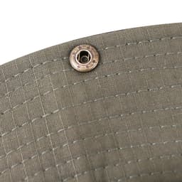 A close-up of an olive green outdoor brim hat, featuring a metal fastener.