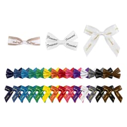A variety of adhesive bows in multiple colours, including white, black, blue, and red, arranged in rows.