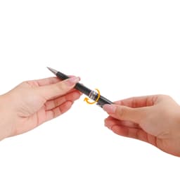 A metal pen in black being rotated by hands, showcasing its sleek design and functional features.