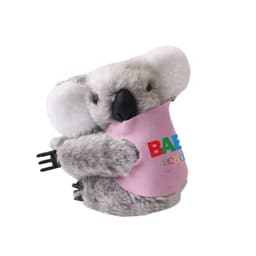 A grey koala plush toy with large ears, holding a black clip, featuring a colourful logo on its pink shirt.