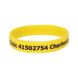 A yellow silicone wristband featuring black text and a logo, promoting a clinic in Cherbourg.