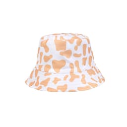 A cow print bucket hat featuring a white base with orange splashes and a circular brim. It has a logo on the side.