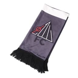 A velvet scarf in shades of grey and white, featuring a logo and black fringes at the ends.