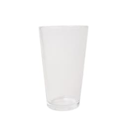 A clear glass cocktail shaker with a sleek design, featuring a rounded base and tall body.