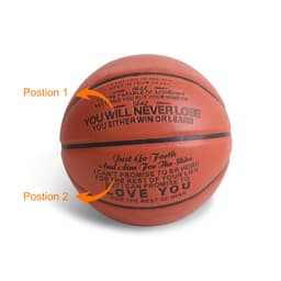 A PU basketball in orange with textured surface and a logo, featuring motivational text in black on two positions.