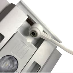 A white power connector attached to a silver LED light box display with a close-up view of the assembly.