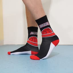 Crew sport socks in black and red with a basketball-themed design, featuring branding and a contrasting white heel and toe.