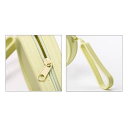 A round silicone storage bag in light green with a zipper closure and a loop handle. Features a logo.