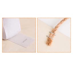 A textured white fabric strip with a logo, alongside a natural rope tied with a metal clip against a light surface.