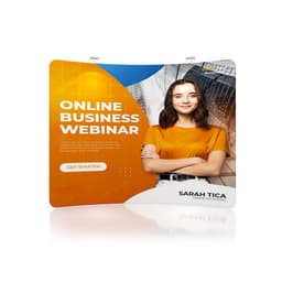 A C-shaped tension fabric display wall in orange and blue featuring a smiling woman and promotional text.