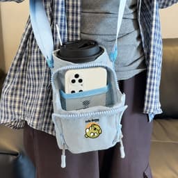 A drink bottle holder in light blue with a strap, featuring a pocket for a phone and a logo design.