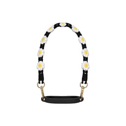A drink bottle strap featuring a black background with woven white and yellow daisies and gold clips.