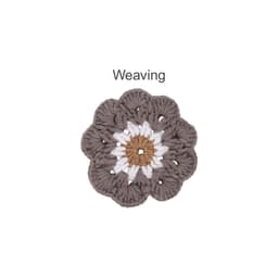 A crochet coaster designed in brown, white, and grey, resembling a flower with textured petals. It features a logo.