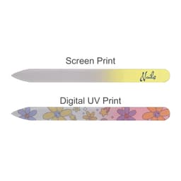 A gradient glass nail file featuring a yellow to pink gradient, adorned with a floral design on one side and a logo.