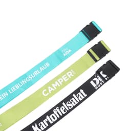 Three poly ribbed luggage belts in teal, lime green, and black, featuring different designs and buckles.