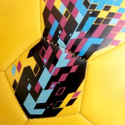 A yellow soccer ball featuring a vibrant geometric pattern in blue, pink, and black, with a logo present.
