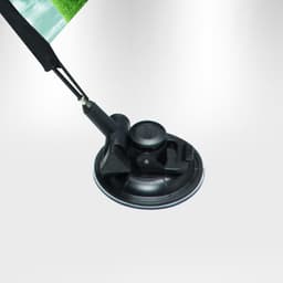 A black suction cup with an attached flag pole featuring a vibrant green flag.