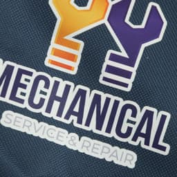 A navy tool kit bag featuring a logo with orange and purple elements.