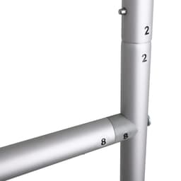 A metallic dispenser stand featuring silver pipes with numbered markings.